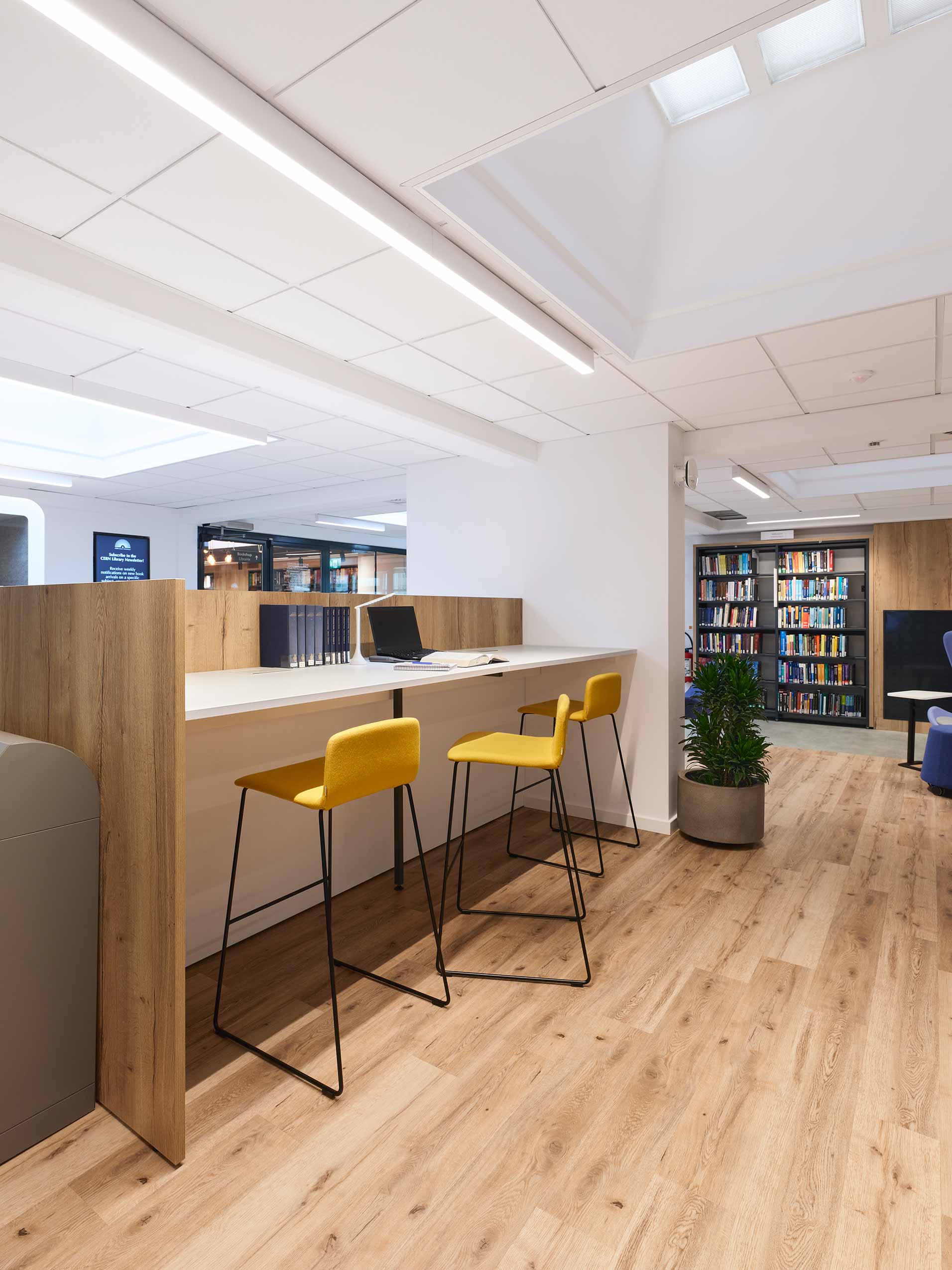 Yellow Profim Com stools in library space at CERN Lab