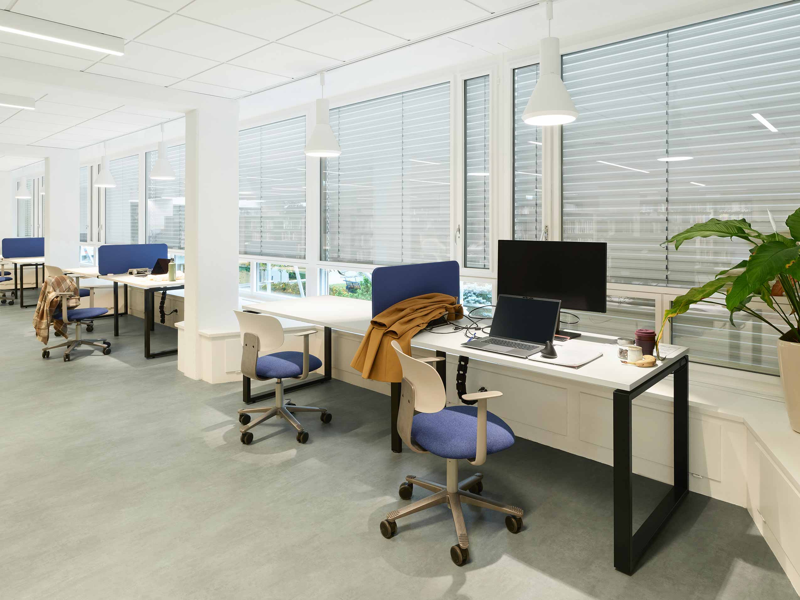 HÅG Tion chairs at workstations in office space at CERN Lab